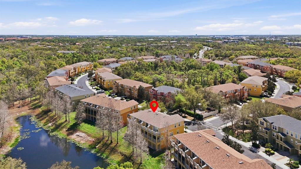 9038 White Sage Loop Lakewood Ranch, FL 34202 - Photo 45 of 52 an aerial view of a city with lots of residential buildings ocean and mountain view in back