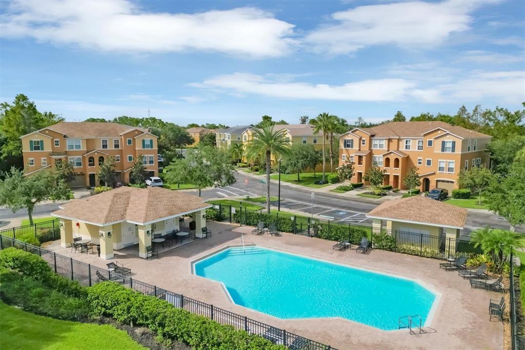 9038 White Sage Loop Lakewood Ranch, FL 34202 - Photo 50 of 52 a view of a house with a big yard and large trees