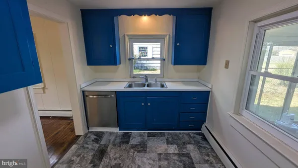 a bathroom with a sink a vanity and a mirror