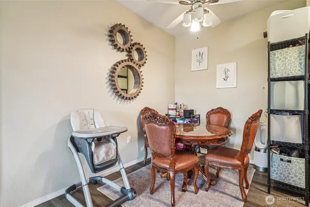 a kitchen with kitchen island a sink stove and microwave