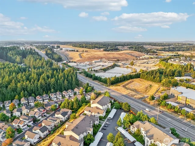 a view of a car parked in front of houses