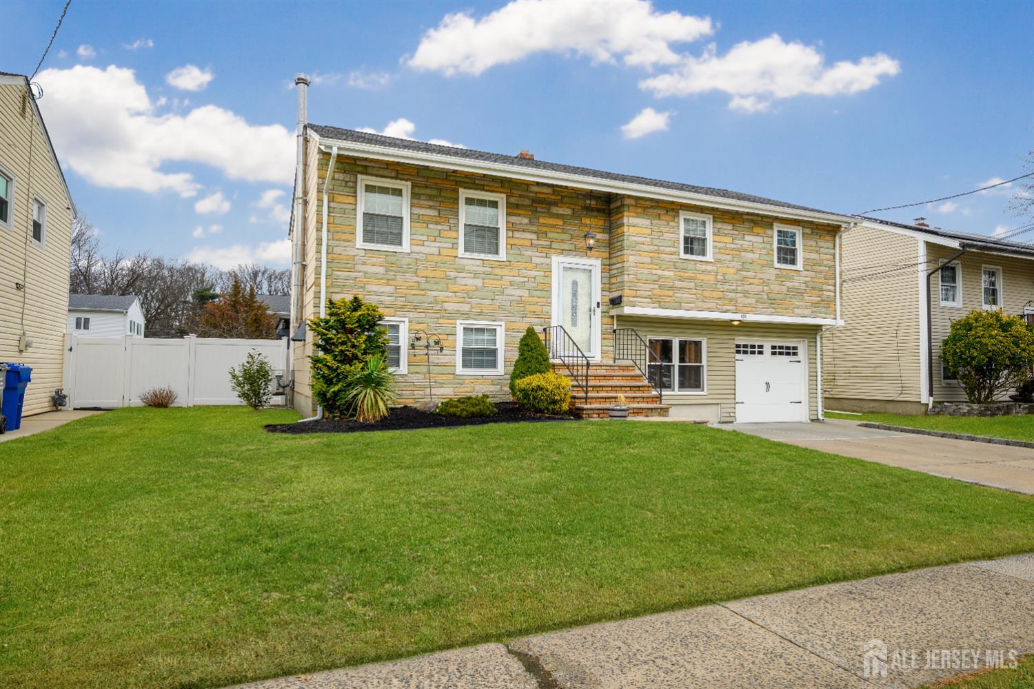 178 Grant Avenue Colonia, NJ 07067 - Photo 1 of 39 a view of a house with a yard porch and sitting area