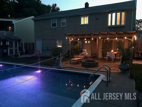 178 Grant Avenue Colonia, NJ 07067 - Photo 12 of 39 a view of a patio with swimming pool table and chairs