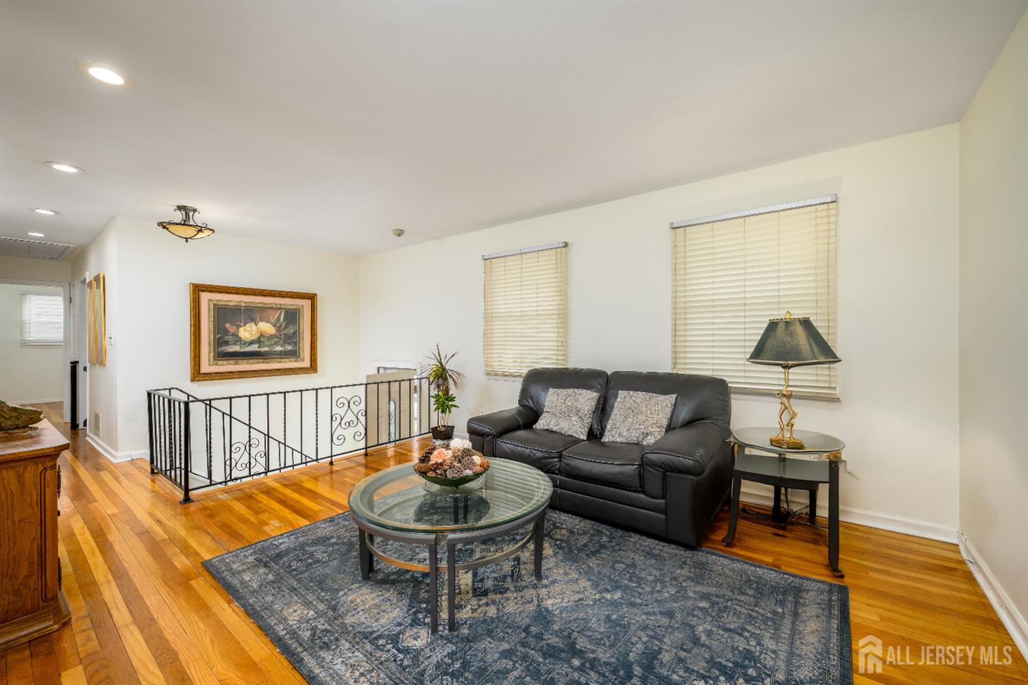 178 Grant Avenue Colonia, NJ 07067 - Photo 13 of 39 a living room with furniture and a wooden floor