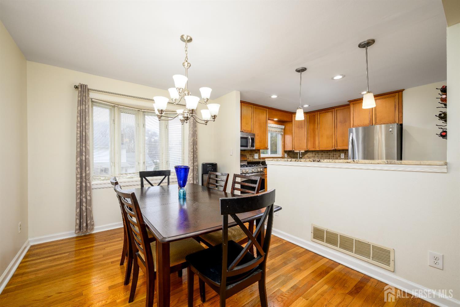 178 Grant Avenue Colonia, NJ 07067 - Photo 15 of 39 a view of a dining room with furniture window and wooden floor