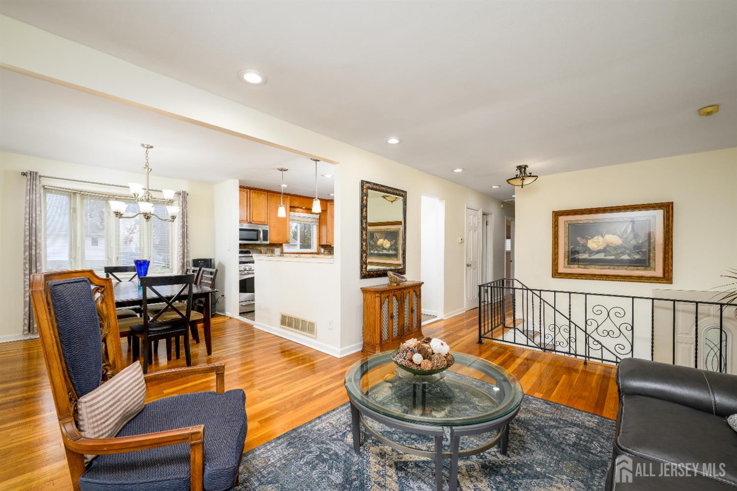 178 Grant Avenue Colonia, NJ 07067 - Photo 18 of 39 a living room with furniture and a wooden floor