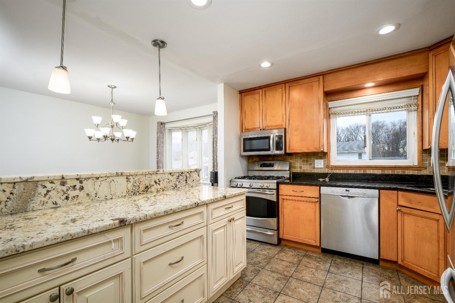 178 Grant Avenue Colonia, NJ 07067 - Photo 19 of 39 a kitchen with stainless steel appliances granite countertop a sink a stove and cabinets