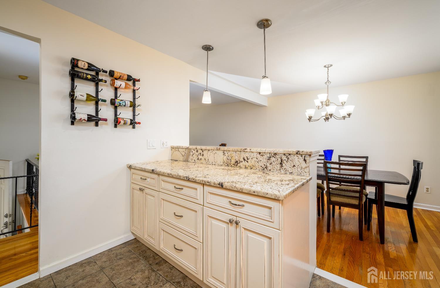 178 Grant Avenue Colonia, NJ 07067 - Photo 3 of 39 a view of a center island and dining table