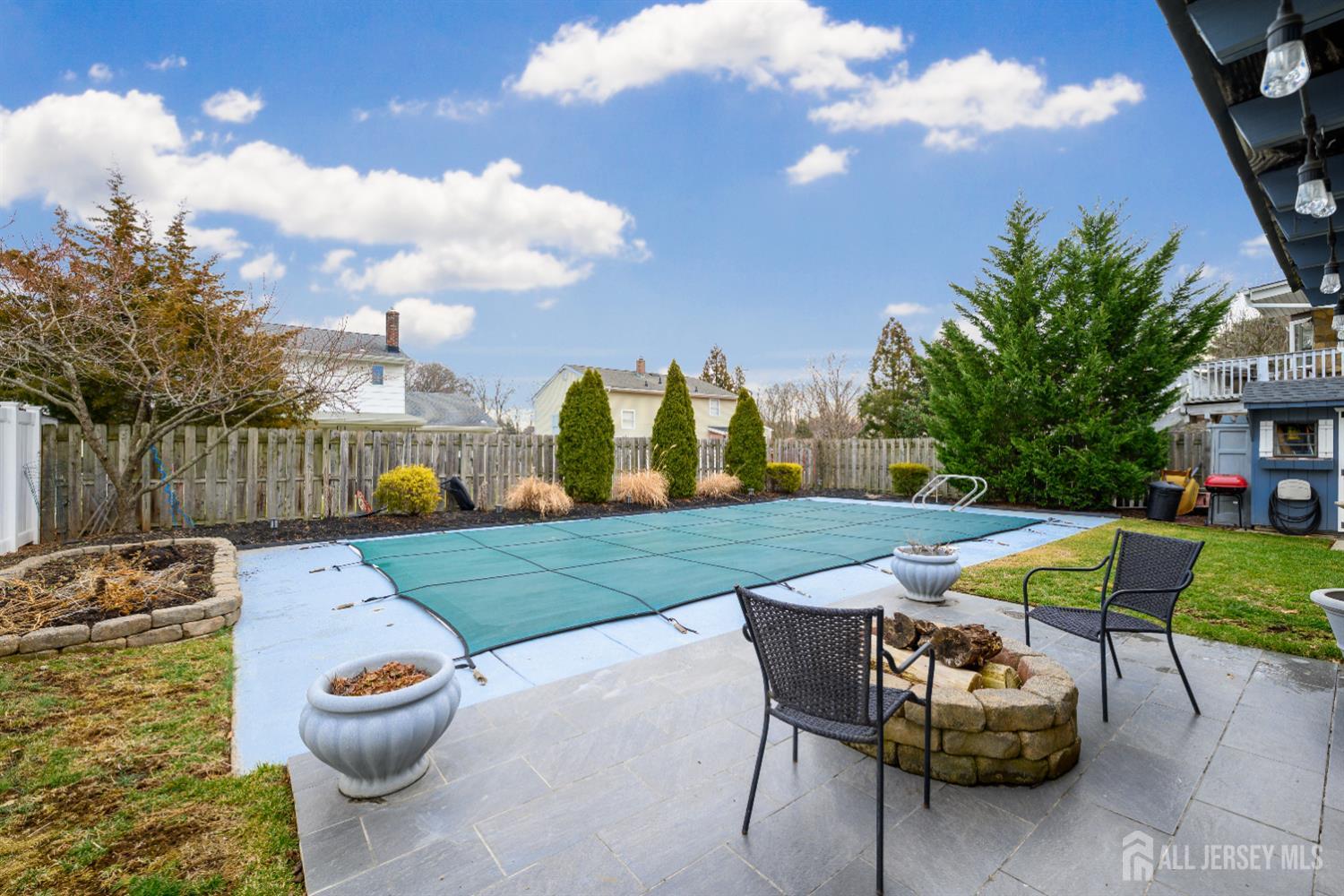 178 Grant Avenue Colonia, NJ 07067 - Photo 32 of 39 a backyard of a house with table and chairs