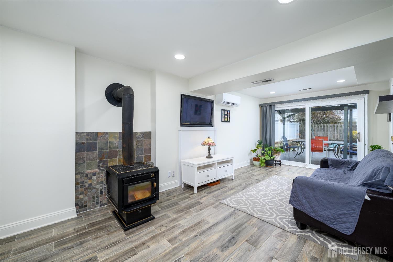 178 Grant Avenue Colonia, NJ 07067 - Photo 5 of 39 a living room with furniture and a flat screen tv