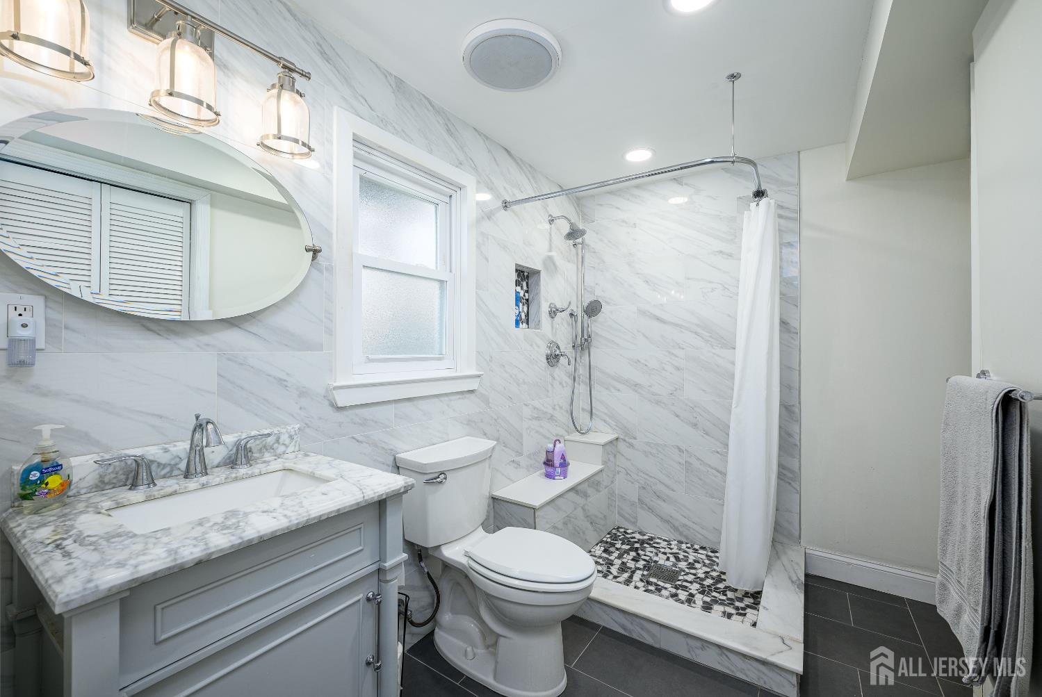 178 Grant Avenue Colonia, NJ 07067 - Photo 7 of 39 a bathroom with a granite countertop sink toilet and shower