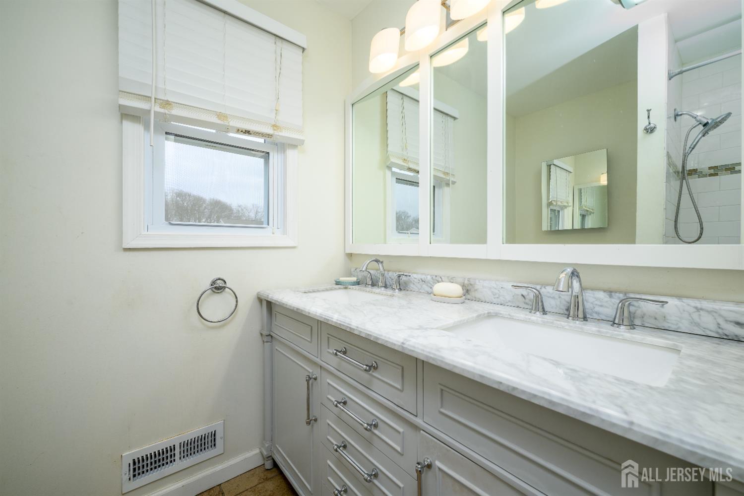 178 Grant Avenue Colonia, NJ 07067 - Photo 9 of 39 a bathroom with a granite countertop sink a mirror and a