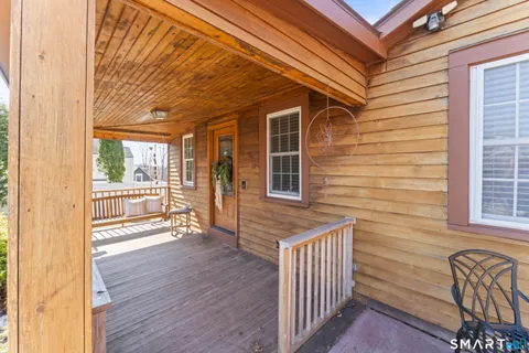 a view of front door of house with wooden floor