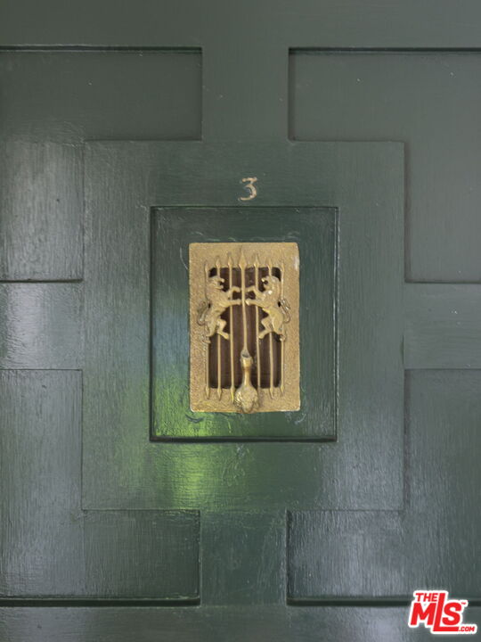 6366 Orange Street Los Angeles, CA 90048 - Photo 12 of 17 a sign that is on a refrigerator in a bathroom