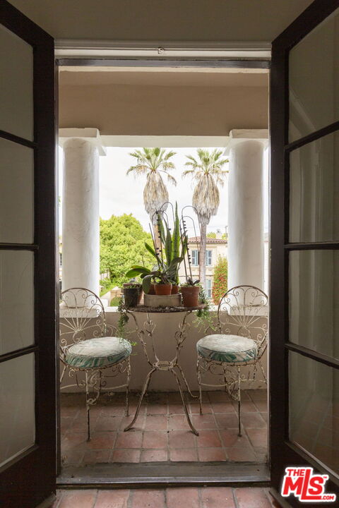 6366 Orange Street Los Angeles, CA 90048 - Photo 13 of 17 a living room with furniture and a large window
