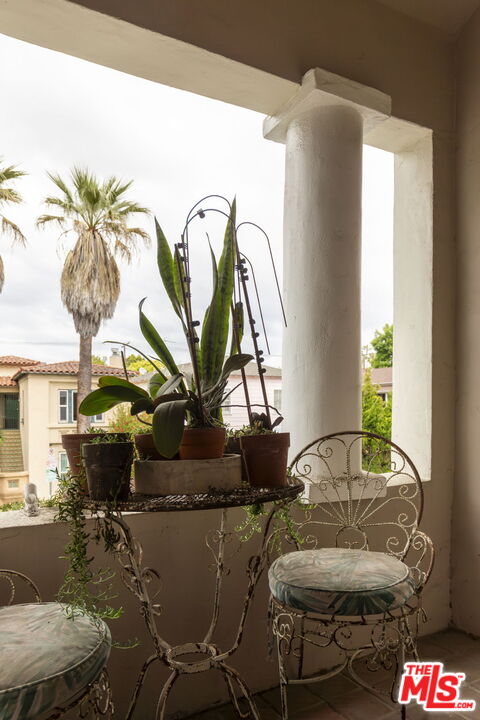 6366 Orange Street Los Angeles, CA 90048 - Photo 14 of 17 a living room with furniture and a potted plant