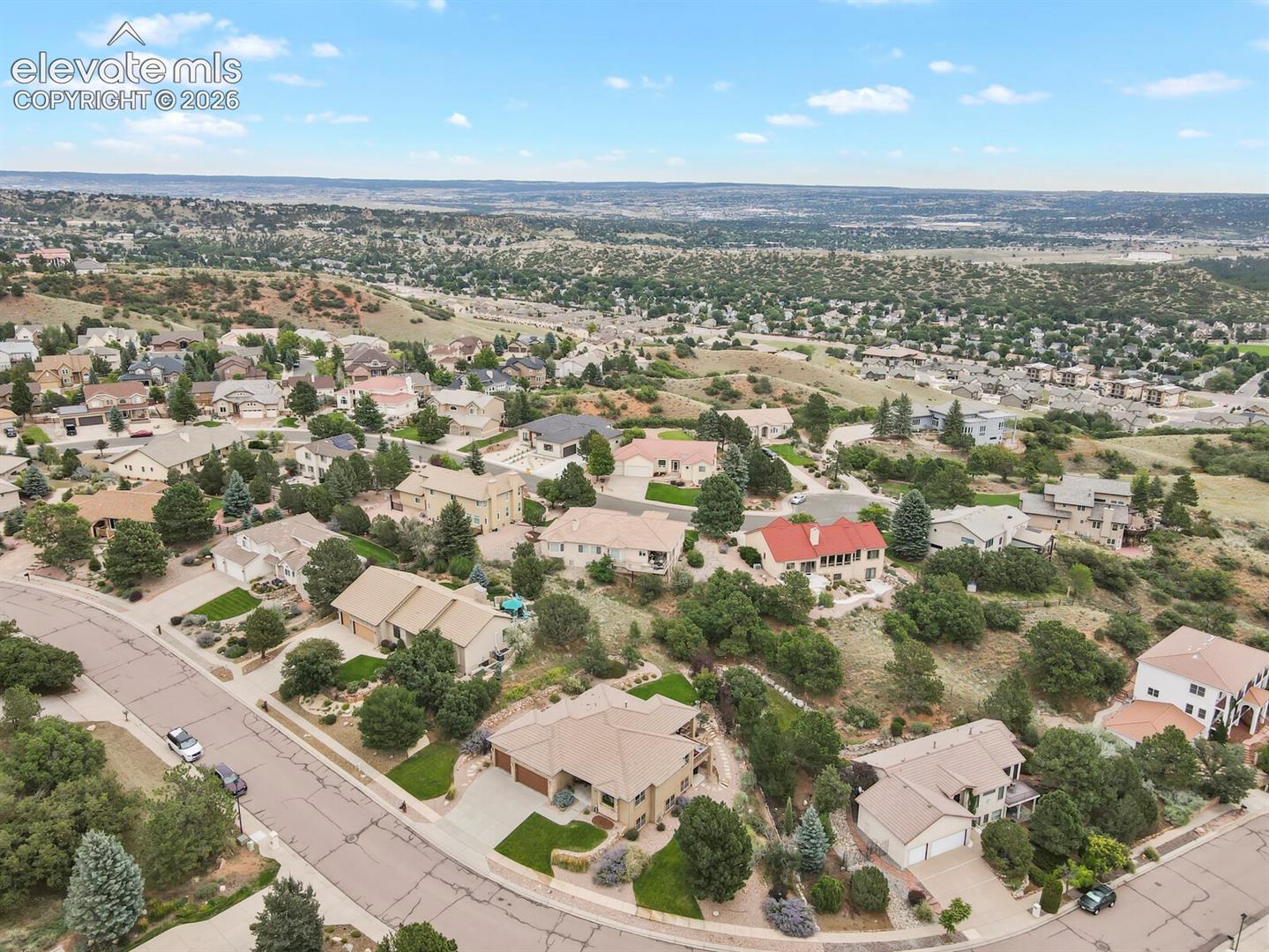 5545 Wilson Road Colorado Springs, CO 80919 - Photo 43 of 48 Residential neighborhood with mature trees, city and mountain views.