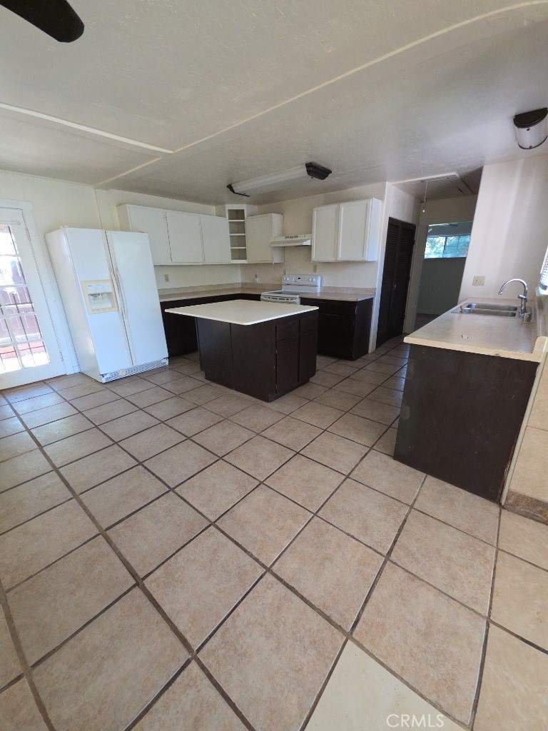 9633 Middle Creek Road Upper Lake, CA 95485 - Photo 4 of 18 a kitchen with stainless steel appliances a sink a counter top space and cabinets