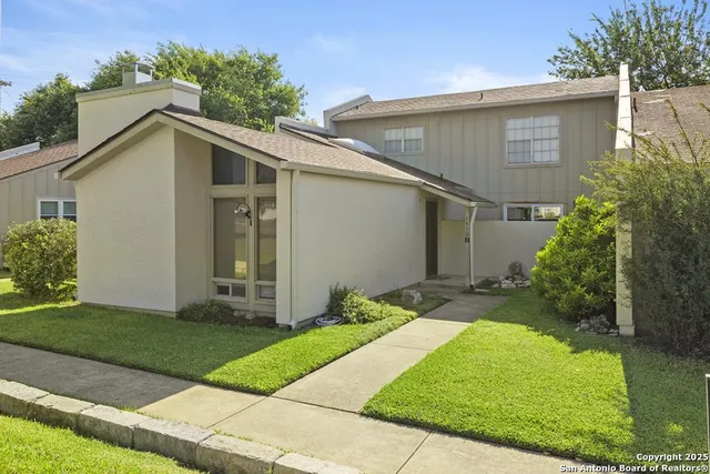 a view of a backyard of the house