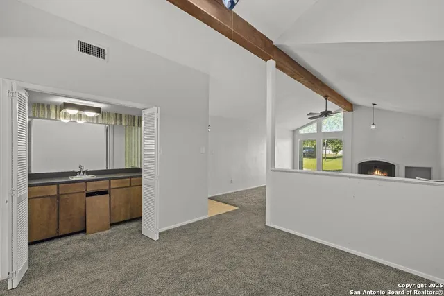 a view of a kitchen cabinets and a window