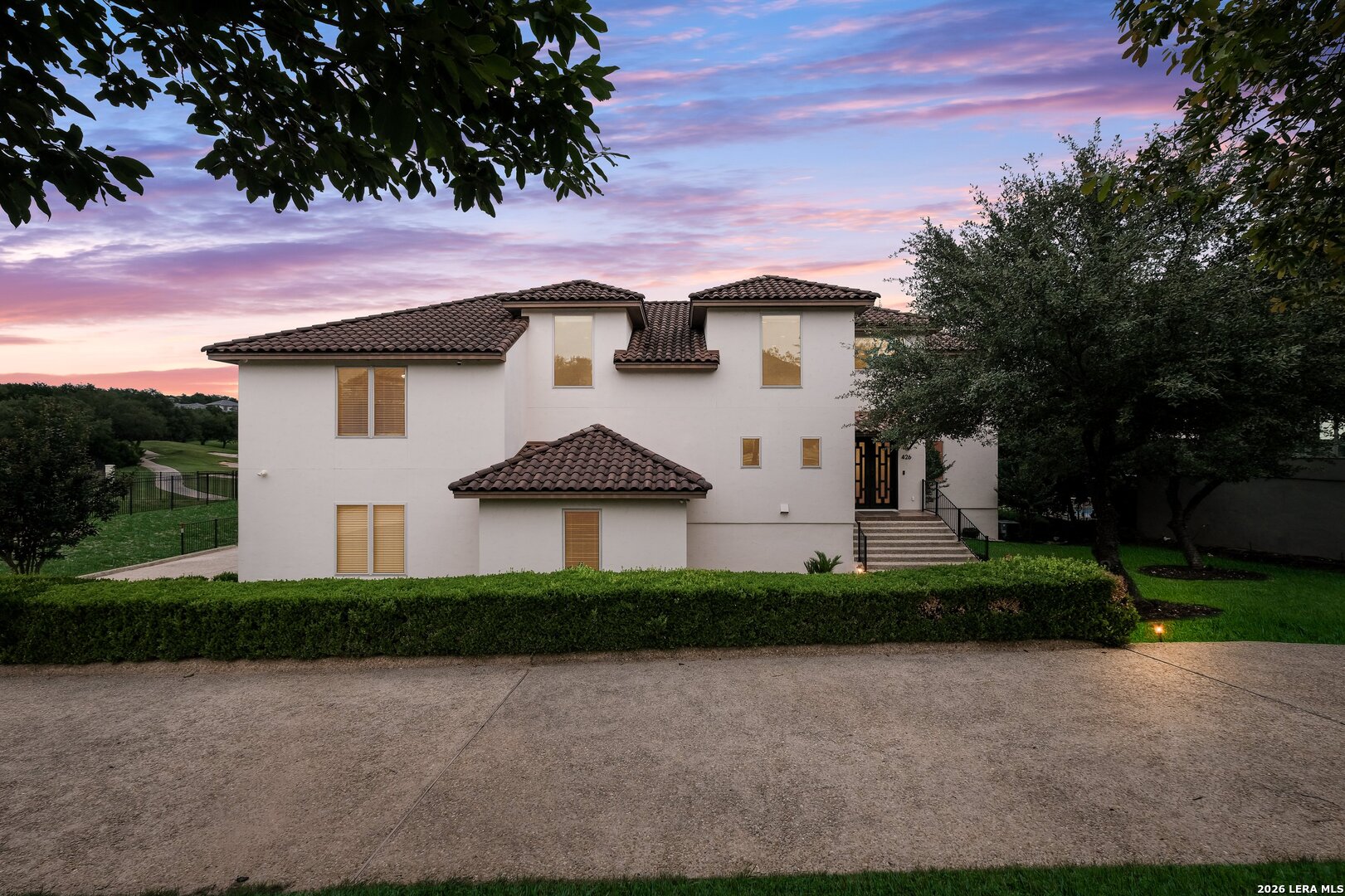 426 Legacy Ridge San Antonio, TX 78258 - Photo 1 of 38 a front view of a house with a yard and garage