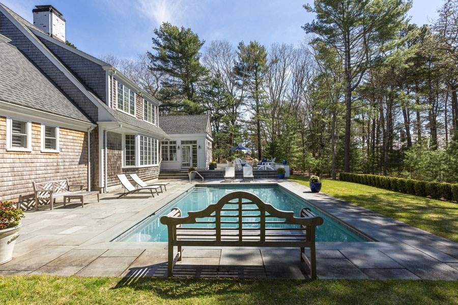 25 Oakdale Path Barnstable, MA 02655 - Photo 11 of 42 a swimming pool with outdoor seating and yard