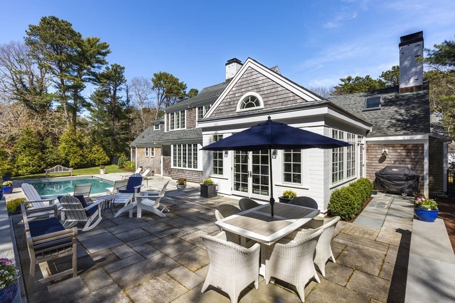 25 Oakdale Path Barnstable, MA 02655 - Photo 12 of 42 an outdoor space with furniture and umbrella