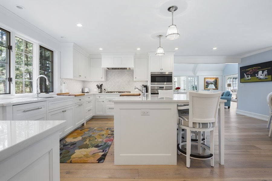 25 Oakdale Path Barnstable, MA 02655 - Photo 30 of 42 a open kitchen with white cabinets and wooden floor