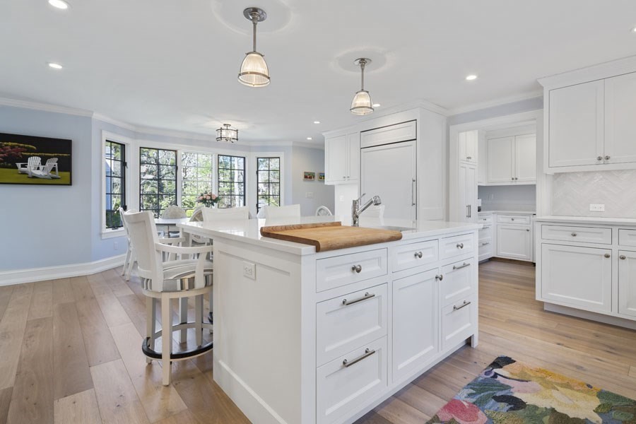 25 Oakdale Path Barnstable, MA 02655 - Photo 32 of 42 a kitchen with stainless steel appliances kitchen island hardwood floor sink stove and wooden cabinets