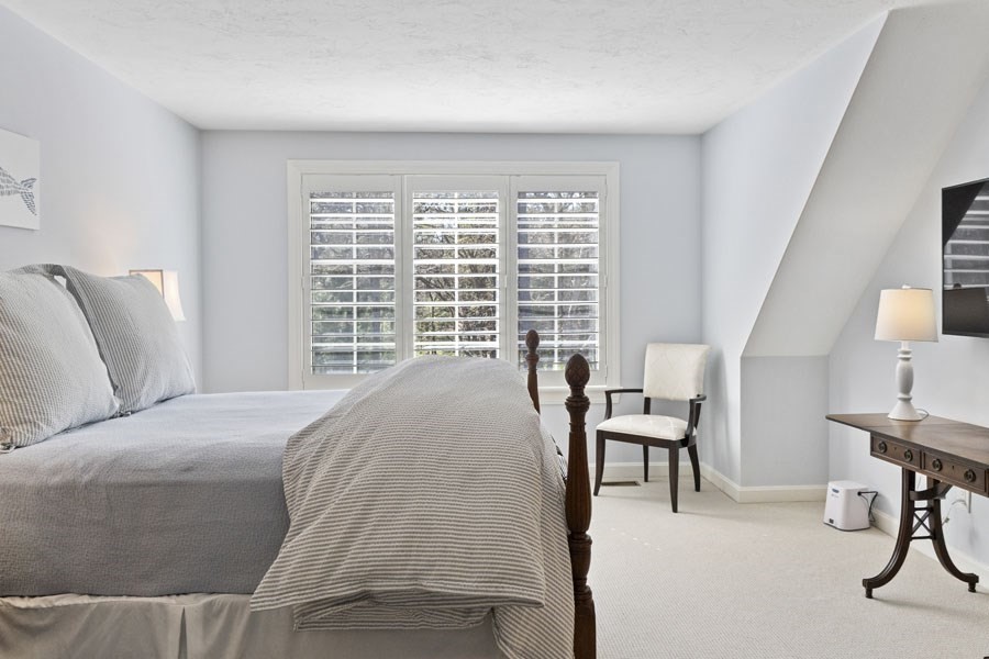 25 Oakdale Path Barnstable, MA 02655 - Photo 37 of 42 a bed room with a bed and a chair