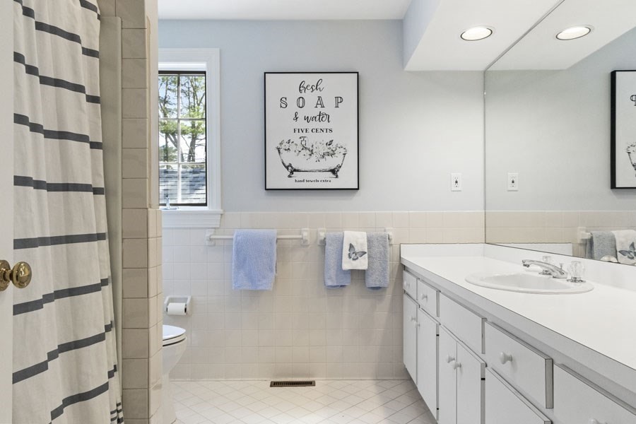 25 Oakdale Path Barnstable, MA 02655 - Photo 38 of 42 a bathroom with a sink and a mirror