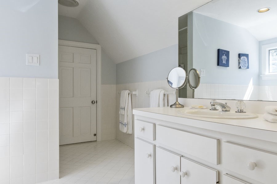 25 Oakdale Path Barnstable, MA 02655 - Photo 40 of 42 a bathroom with a granite countertop sink and a mirror