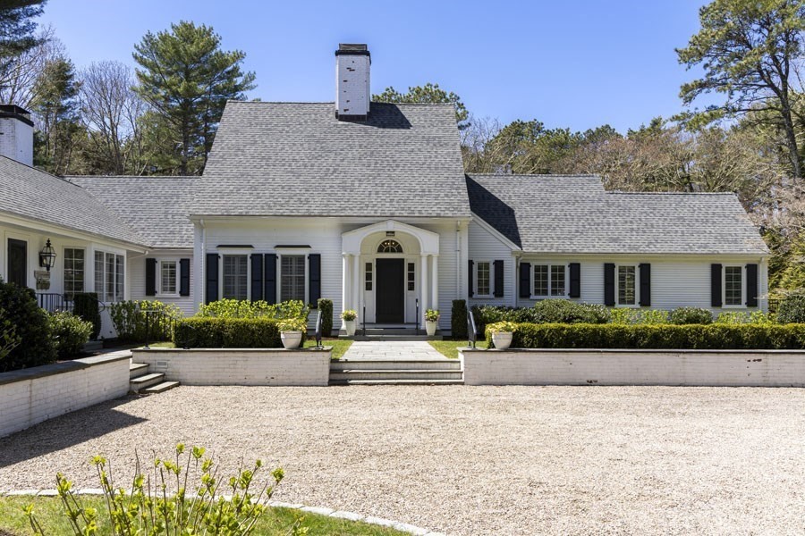 25 Oakdale Path Barnstable, MA 02655 - Photo 5 of 42 a front view of a house with a garden