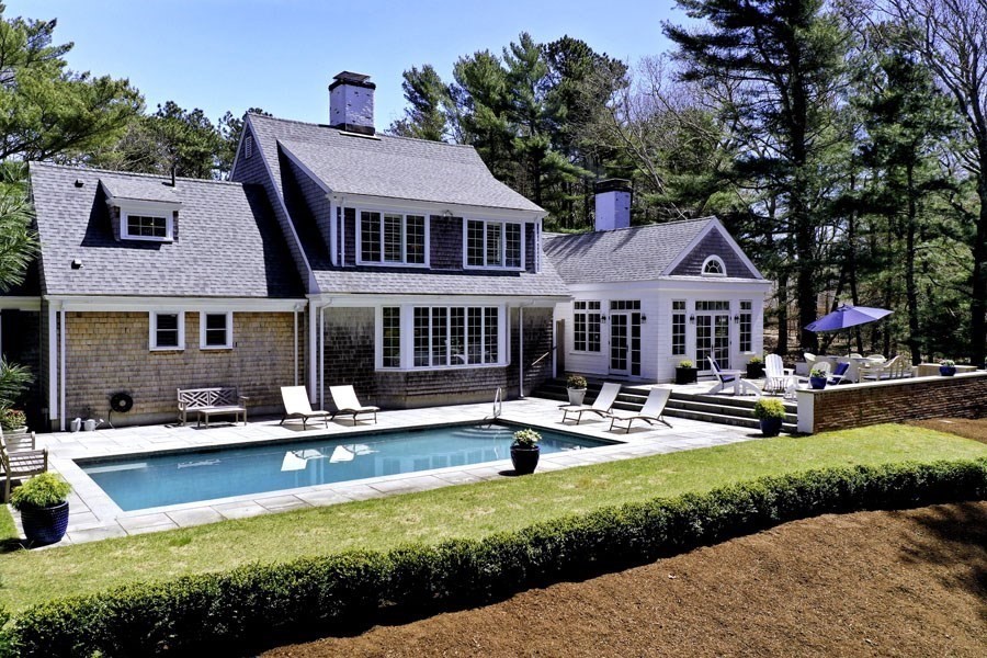 25 Oakdale Path Barnstable, MA 02655 - Photo 9 of 42 a front view of a house with swimming pool and a yard