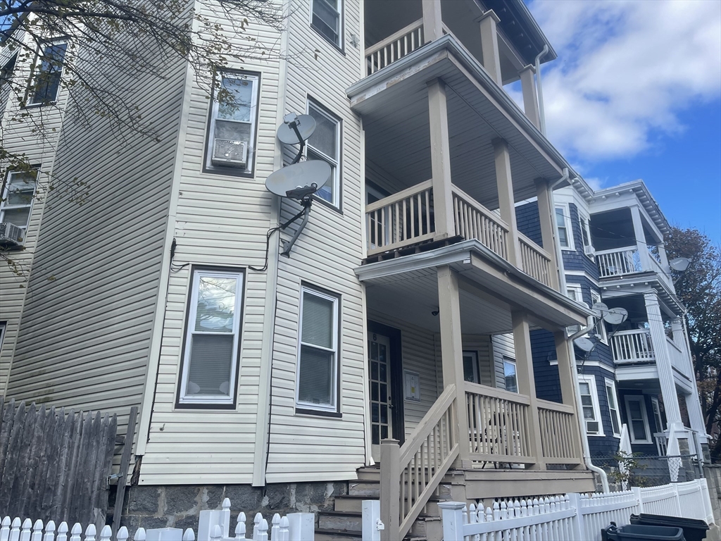 6 Bailey Street, Unit 1 Boston, MA 02124 - Photo 12 of 12 a view of a house with a white house