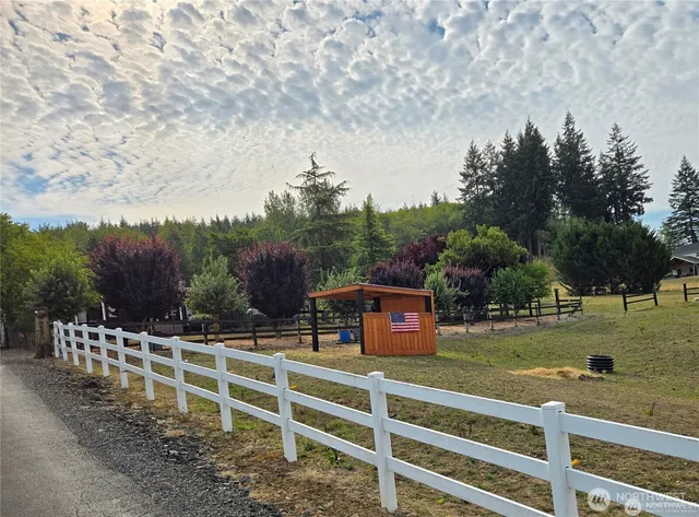 a view of a wooden fence