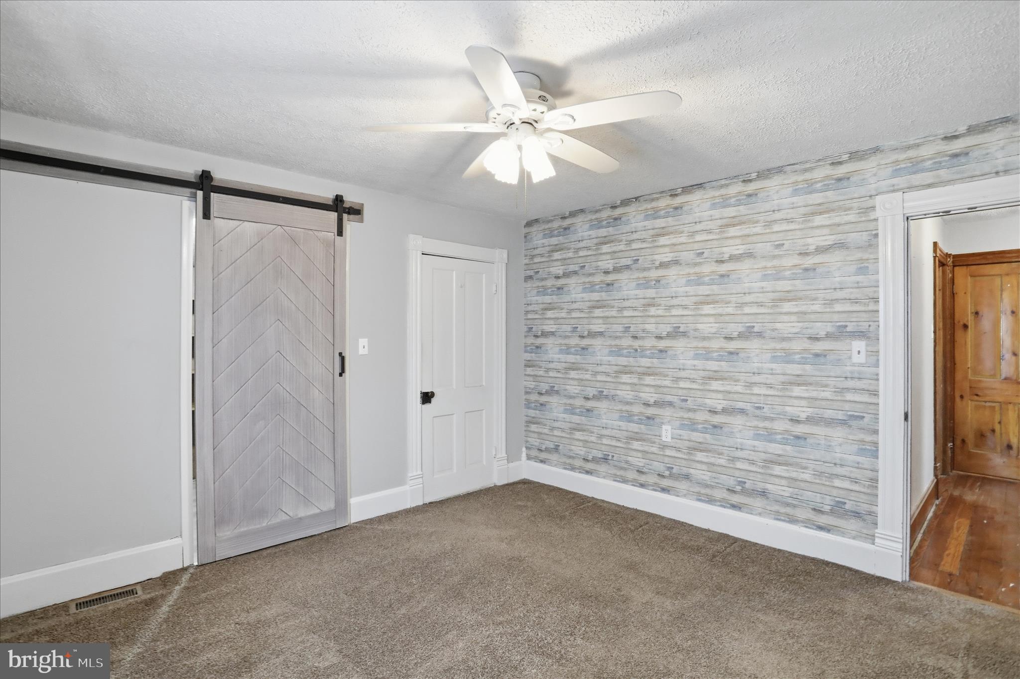 21 Sharpless Street Keyser, WV 26726 - Photo 20 of 33 a view of an empty room with a ceiling fan and window