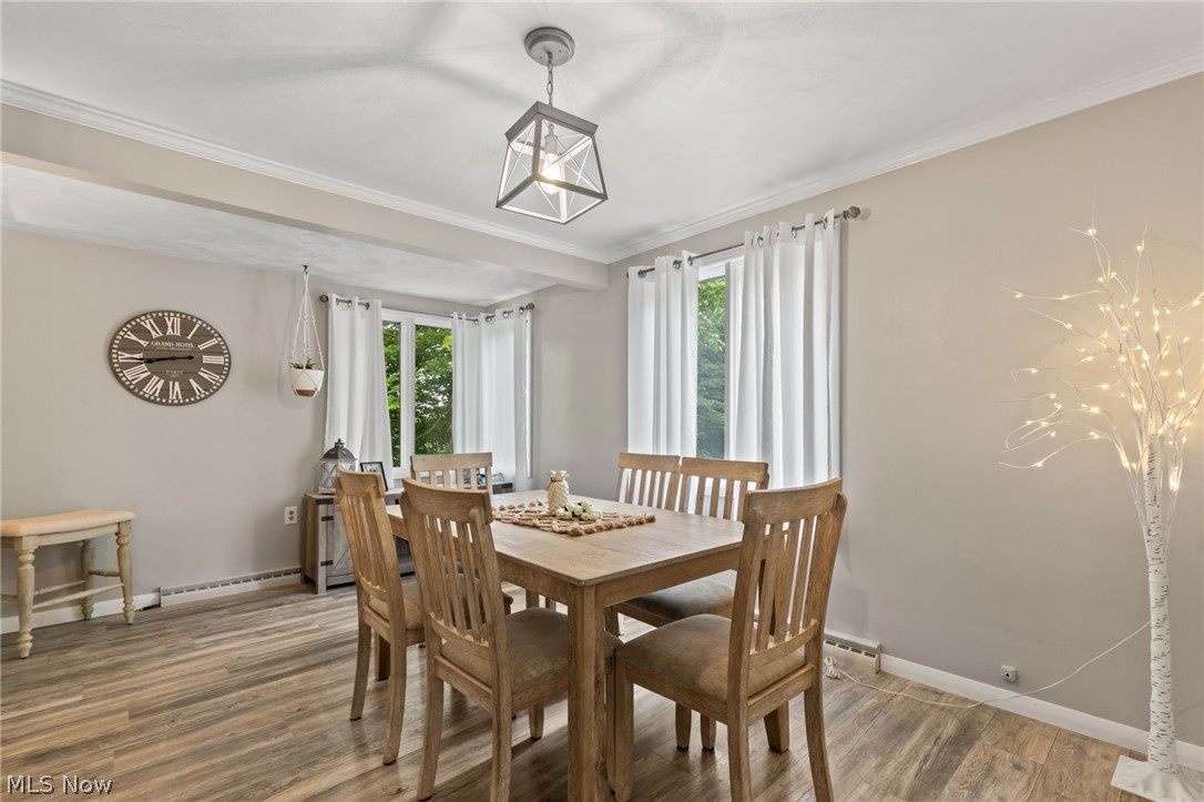3833 Bellville North Road Bellville, OH 44813 - Photo 5 of 24 Dining room with a healthy amount of sunlight, ornamental molding, and hardwood / wood-style floors