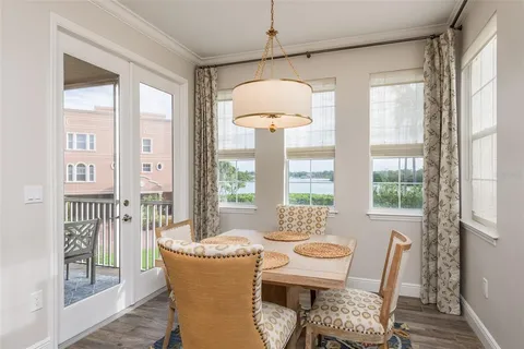 a view of a yard with plants and trees