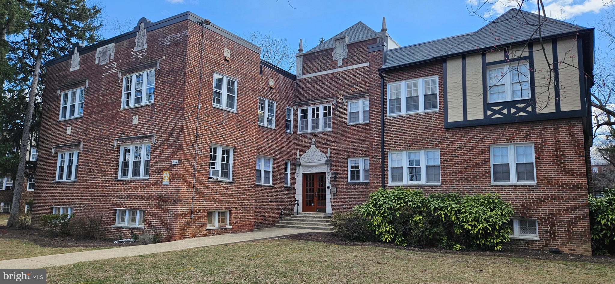 236 Farragut Street Northwest, Unit H203 Washington, DC 20011 - Photo 2 of 30 a front view of a building with a garden