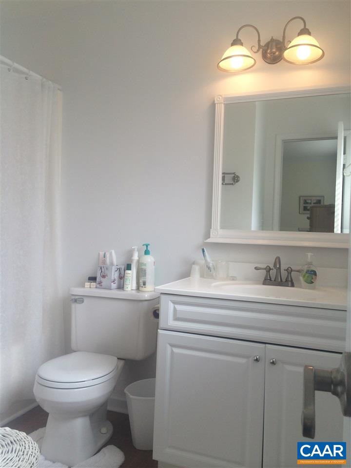 1227 Chatham Ridge Charlottesville, VA 22901 - Photo 14 of 14 a bathroom with a toilet sink and mirror