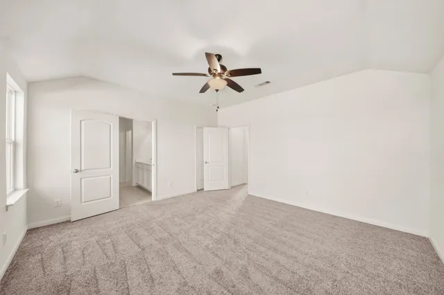 a view of a big room with carpet