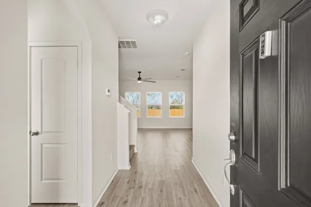a view of a bathroom from the hallway