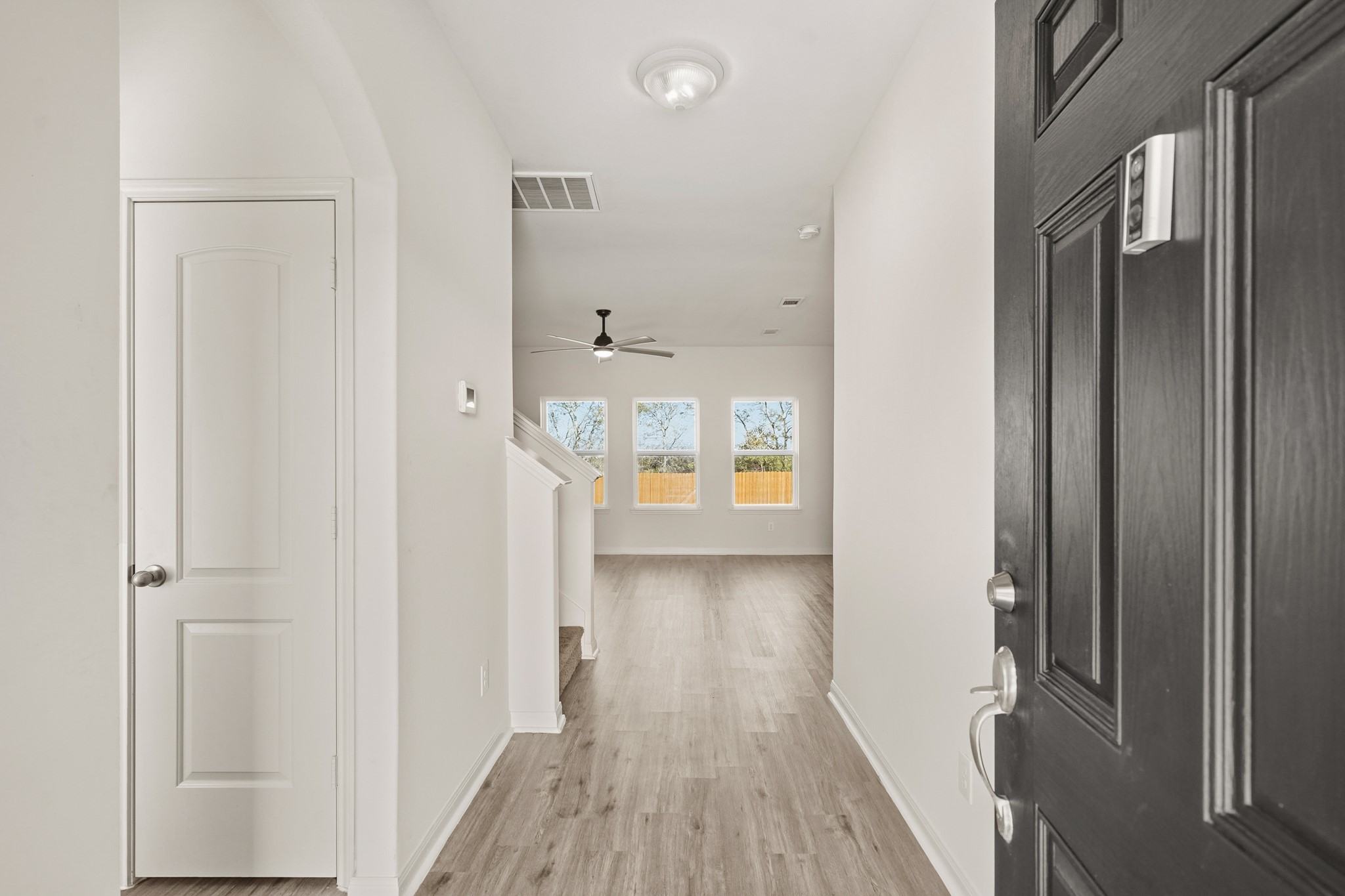 1531 Loose Stone Drive Rosharon, TX 77583 - Photo 3 of 18 You'll be instantly greeted by beautiful vinyl floors, a charming stair case, and a view straight back into the backyard!