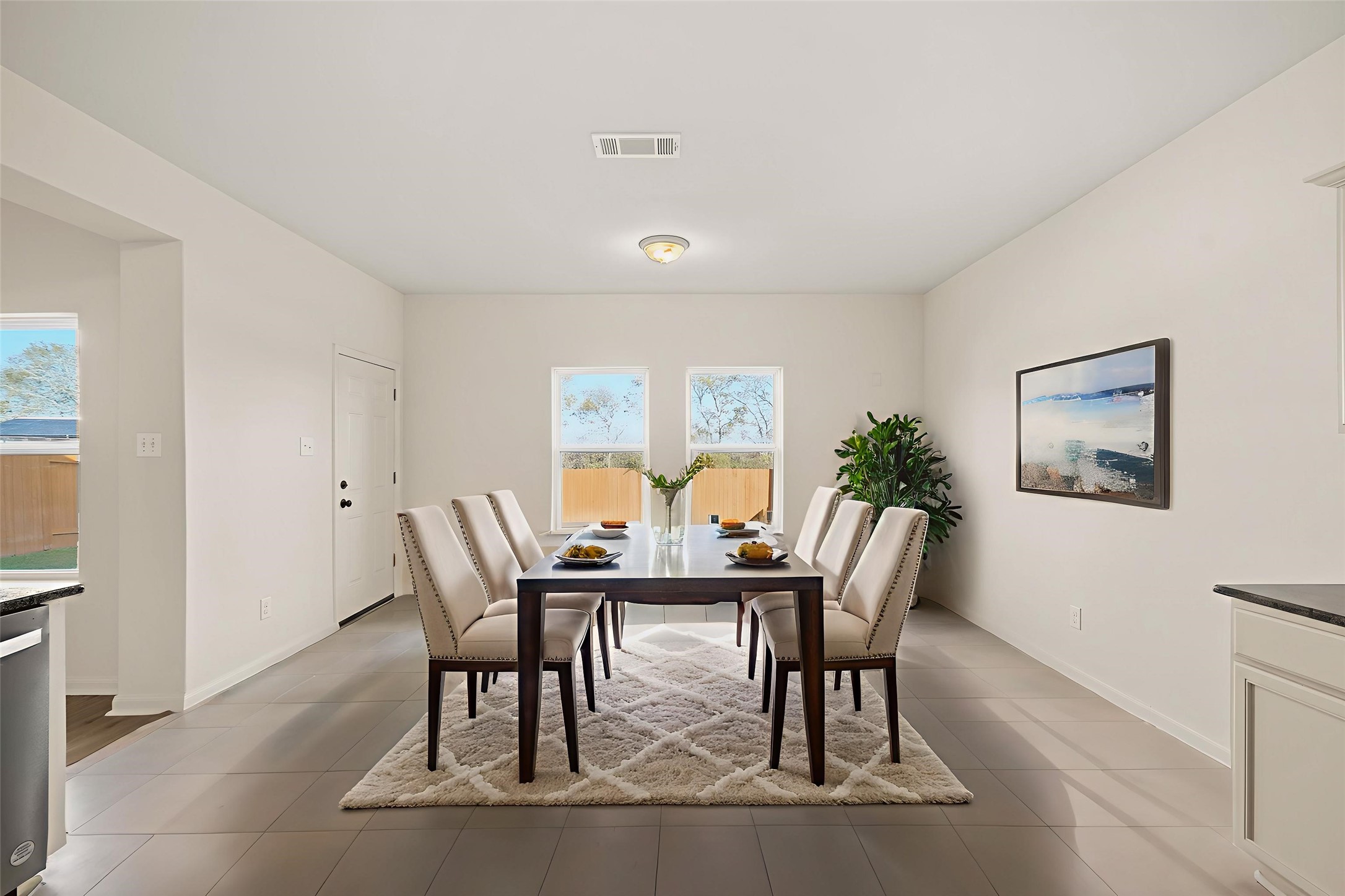 1531 Loose Stone Drive Rosharon, TX 77583 - Photo 8 of 18 Virtually Staged: Charming dining area, complete with tile floors, and beautiful views of the backyard are provided by several windows.