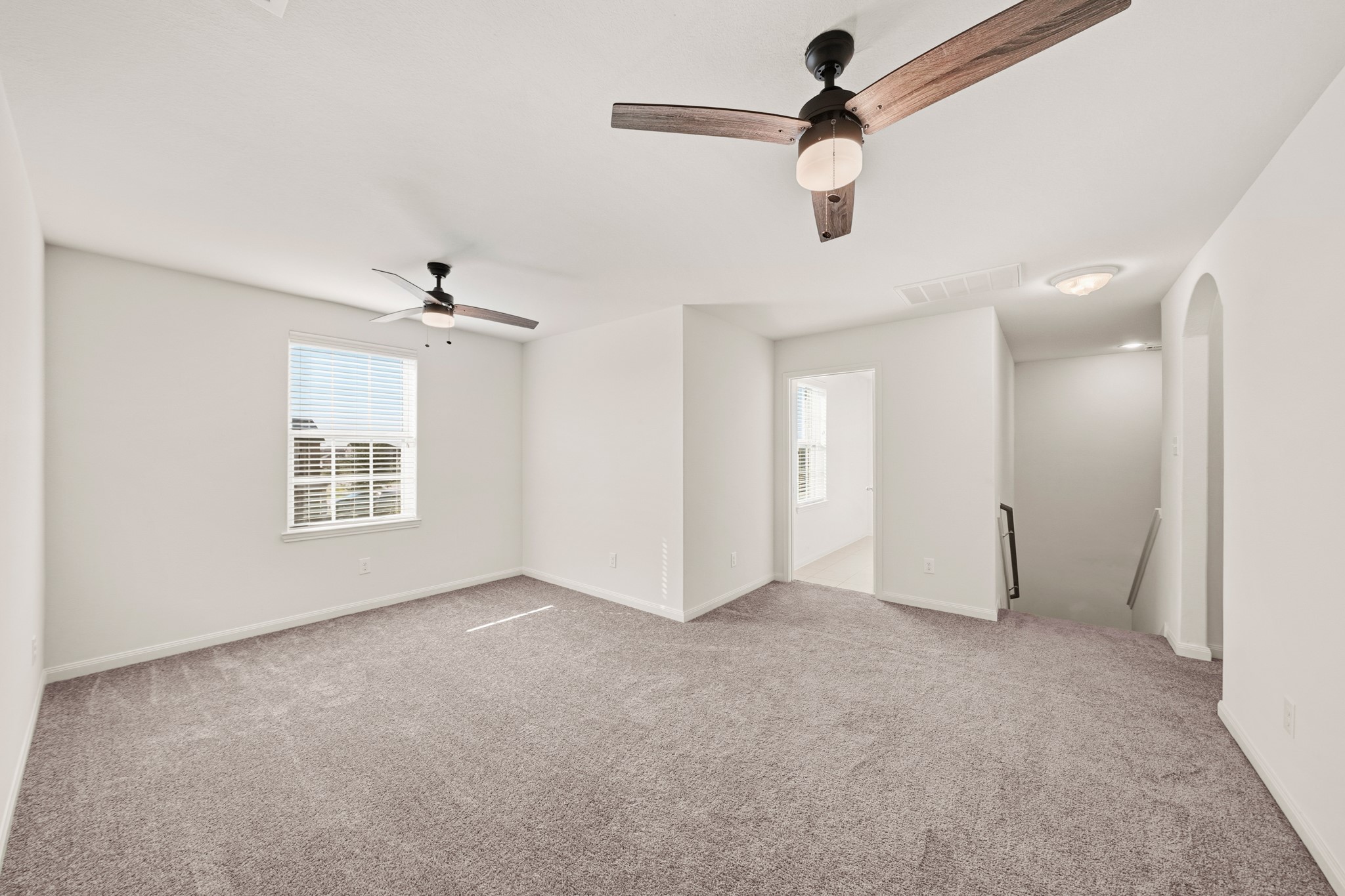 1531 Loose Stone Drive Rosharon, TX 77583 - Photo 9 of 18 WOW! This amazing room is perfect for entertaining! Right upstairs, this space would be a fabulous teen hangout, media room, or adult game room. Featuring carpet floors, dual ceiling fans, and a window with privacy blinds.