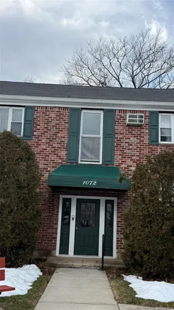 front view of house with a small yard
