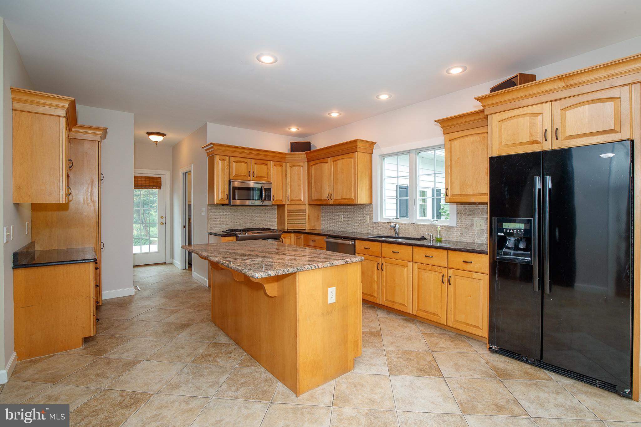 Kitchen With Back Door To Deck & To Garage
