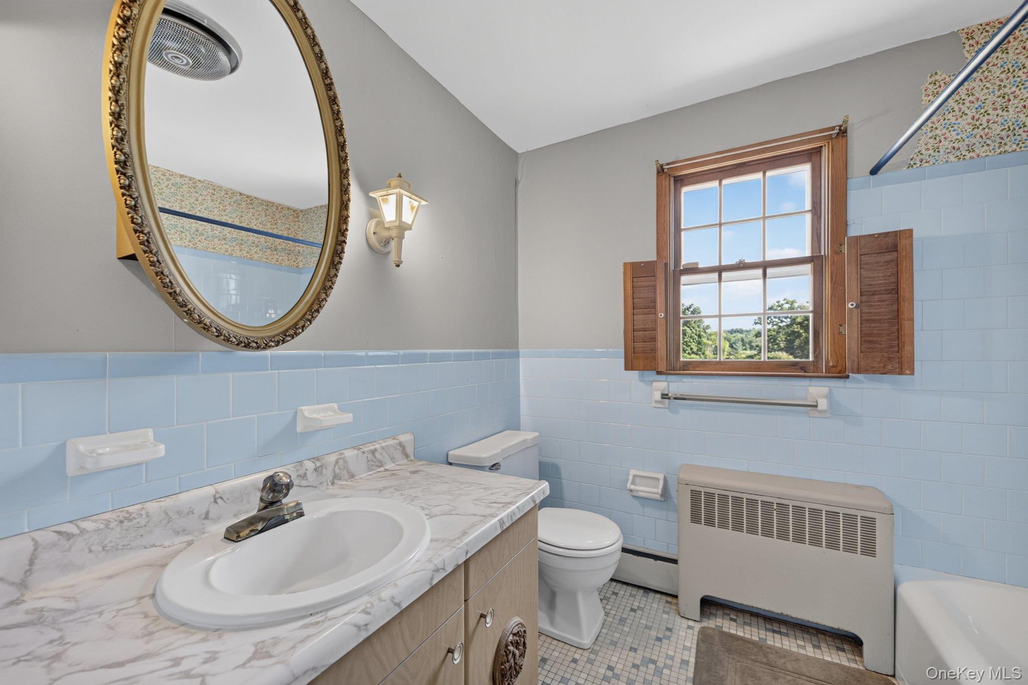 315 Pine Bush Road Stone Ridge, NY 12484 - Photo 19 of 32 a bathroom with a sink and a mirror