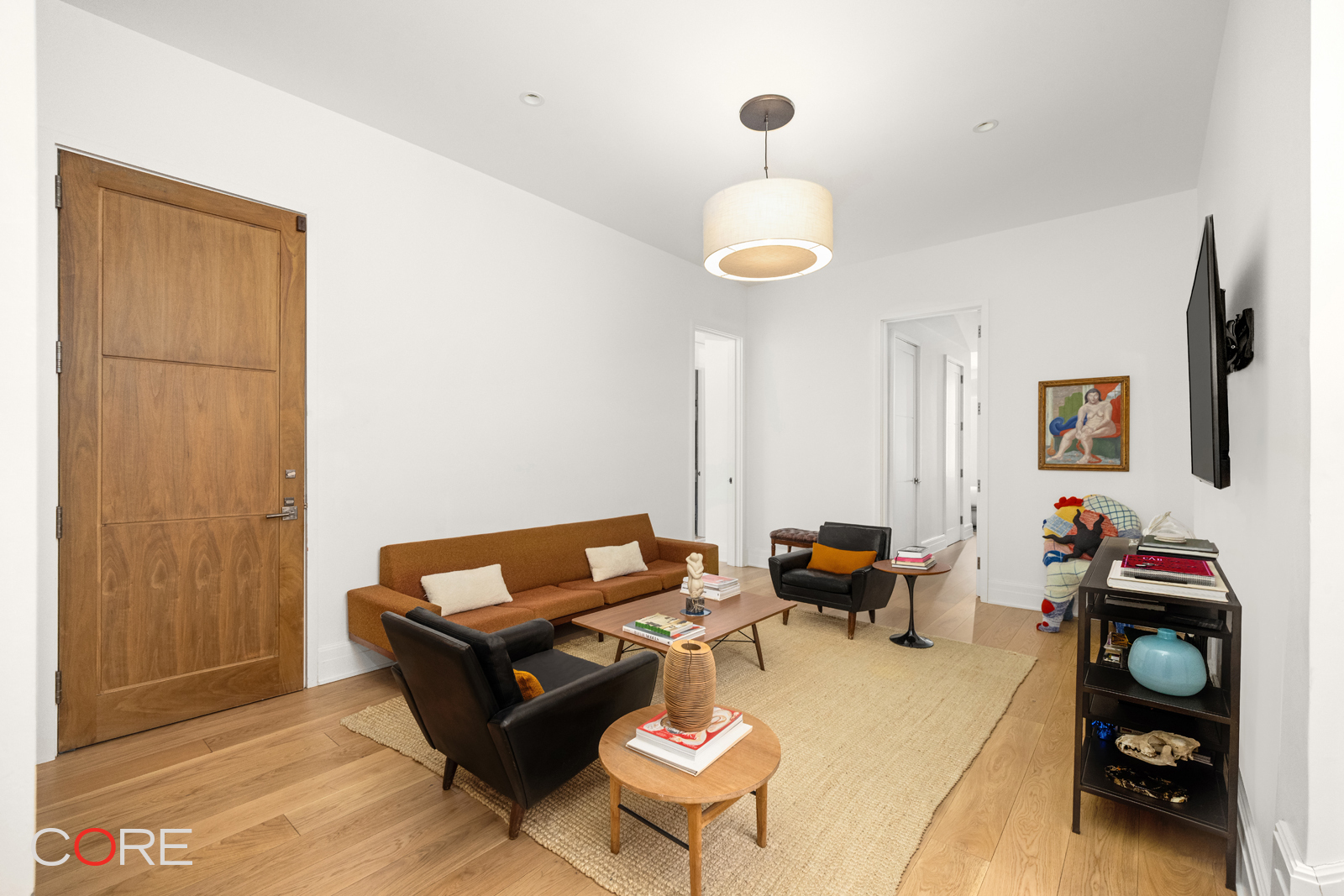 87 Leonard Street, Unit PHB Manhattan, NY 10013 - Photo 10 of 16 a living room with furniture and a flat screen tv